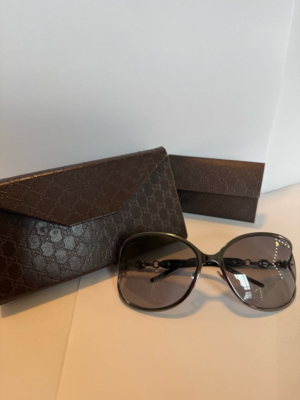 Gucci Oversized Sunglasses with Chain Detail. Gunmetal/ gradient grey